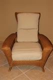 Furnishing – Wicker arm chair with cushioned back and seat. Piece reclines, is sturdy, and very comfortable. Marked ‘Lane Venture’. In very nice condition.