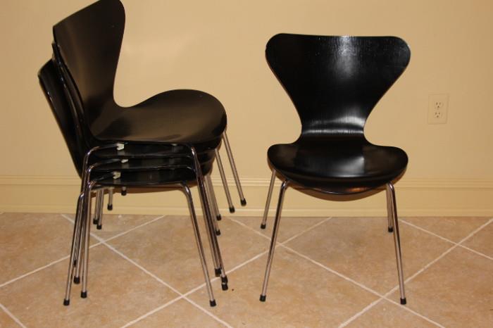 Furniture – 5 piece set of black stackable chairs. Pieces have metal legs. Marked “Fritz Hansen Made in Denmark 1987″