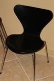 Furniture – 5 piece set of black stackable chairs. Pieces have metal legs. Marked “Fritz Hansen Made in Denmark 1987″