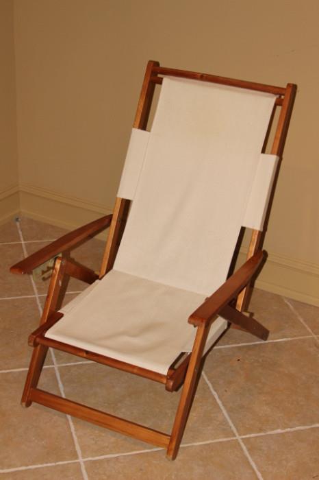 

Furniture – Wooden framed reclining chair. Seat and back are canvas white. In good condition.
