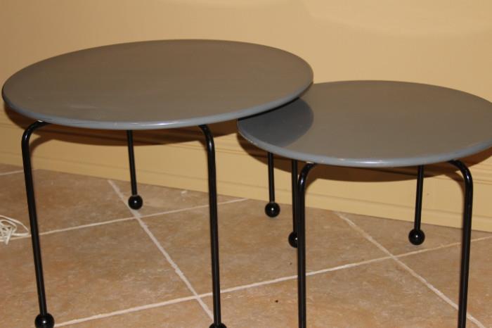 Furnishing – Set of two side tables. Smaller table fits under larger table. Both pieces have round table top and sturdy metal legs. Nice set. 