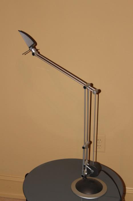 Furnishing – Table top lamp. Piece has adjustable head and neck but is missing a lightbulb and the cover.