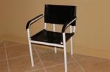 Furnishing – Single chair. Piece has a white frame with black back rest and seat. In good condition.