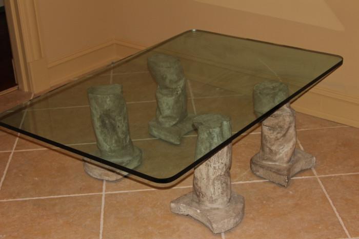 Furniture – Rectangular coffee table. Glass top unique table with four cement legs. Unique piece. Sturdy, no cracks or chips.