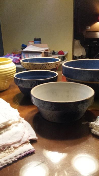 Old blue bowls and old embroidered table runners and doillies