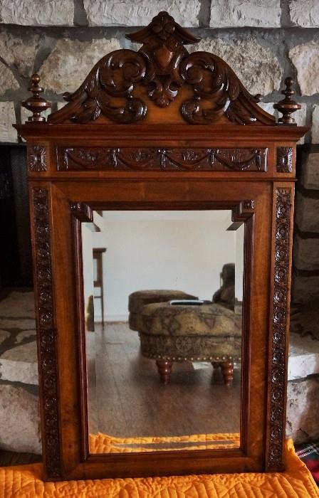 Antique carved beveled glass mirror