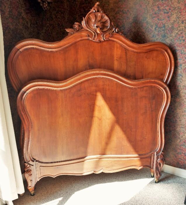 One of a pair of antique beds