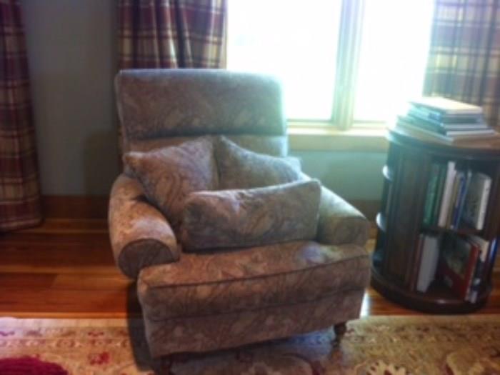 Chair, adjacent library side table and large area rug are for sale