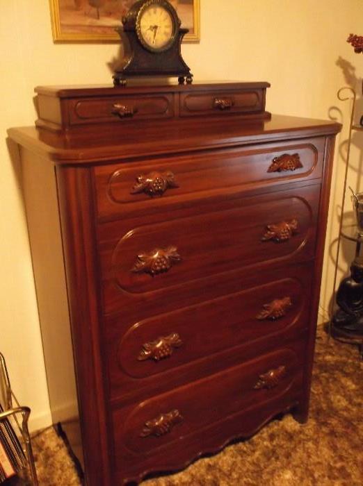 Mahogany chest of drawers with carved pulls and glove box