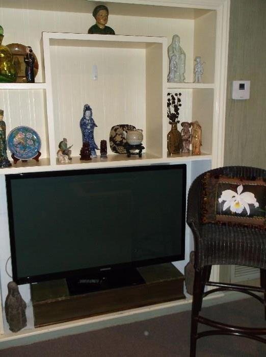 Samsung flat screen TV and another wicker stool