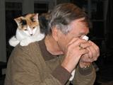 my husband, Larry, the cat lover, with one of our 2 new kitties, checking out a piece of jewelry.