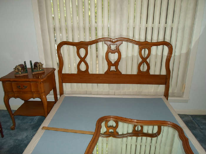 the headboard of the french provencial bed