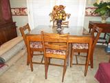 nice vintage table w/glass top and 4 nice chairs
