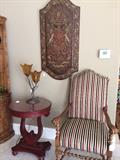       Barley twist striped upholstered armed chair; round top side table; stunning wall panel