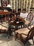 Glass top breakfast table and 6 chairs with cushioned seats; decorative accents