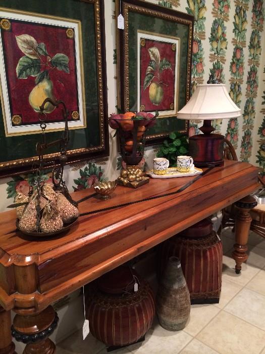 Extra long, sturdy server with framed fruit pictures above