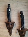             Asian figures on carved wall shelves