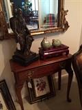 Small side table with 1 drawer; statue, decorative birds, mirror, and fruit print