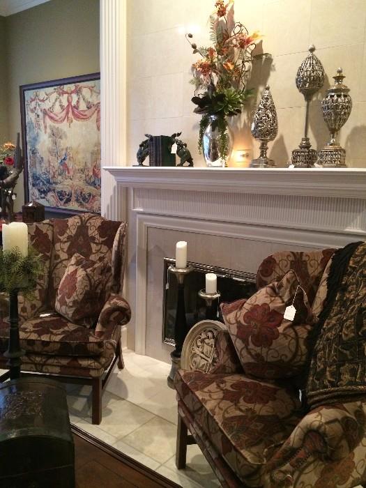 Two richly upholstered wing-back chairs; many decorative accessories