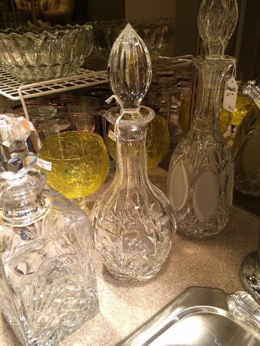 Several pressed glass decanters