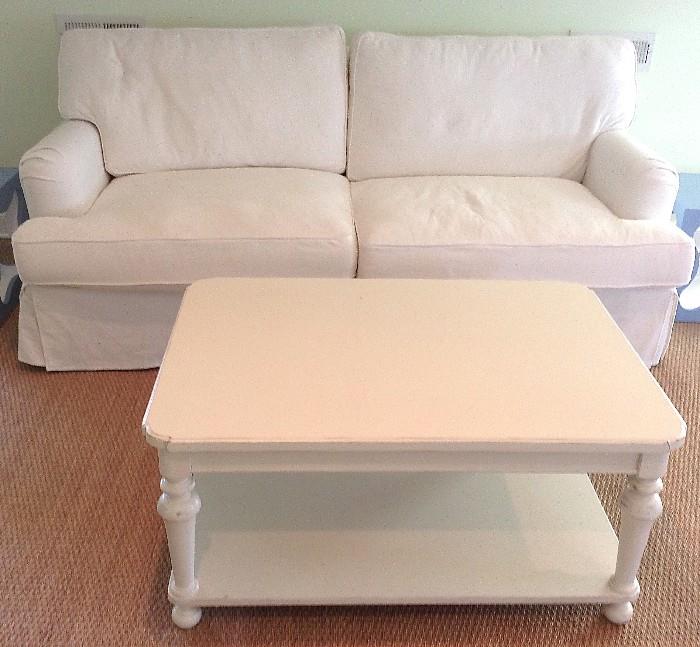 UPHOLSTERED COUCH AND WHITE COFFEE TABLE