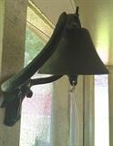 Wrought-iron dinner bell with cow-face attachment