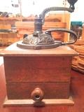 Antique coffee grinder with iron handle