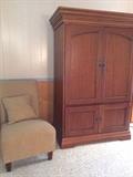 Gorgeous armoire and contemporary puffy side chair