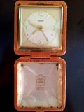Antique alarm clock in leather case