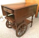 Such a sweet tea cart, wheels in great working condition, with removable tray and drawer--check out the close-up of the wood in next photo