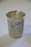 The very fine quality cup engraved with an intricate foliate and bird design, two lions flank Hebrew writing (roughly "bless this event" or similar, in translation).  The cup is appx. 2 7/8" tall.  Marked with unknown hallmarks on base ("12" in square box, another mark more central), possibly (probably) silver.  Probably Poland or Ukraine, maybe 18thC, no later than 1820-1830.  