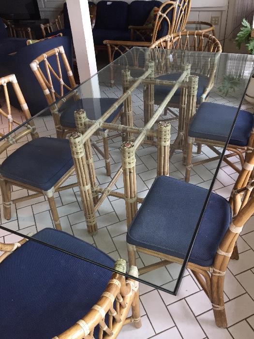 80 x 40 Plate Glass table with 6 chairs All Marked McGuire San Francisco on each piece, there are matching tables and some additional chairs with this set.