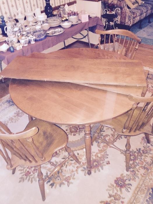 Dining room table in perfect condition shown without the 2 leafs in it just resting on top  comes with 6 matching chairs