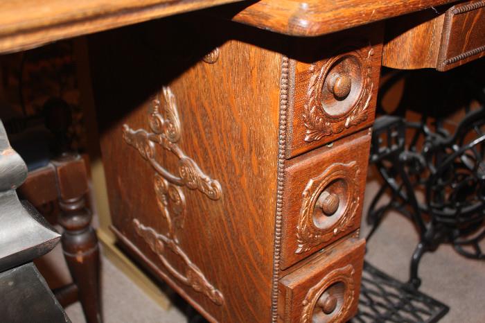Look at the ornate design on the wood sewing table