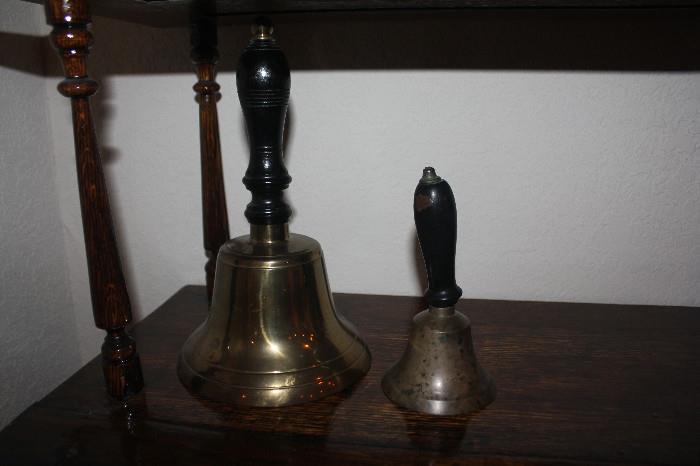 School bell on left and hotel bell boy bell on right.