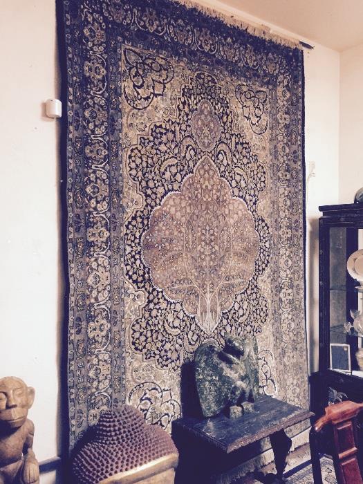 Antique rug and carvings