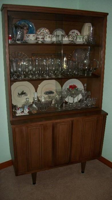 china cupboard and some of the cups and saucers
