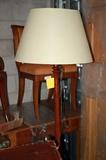 standing wood lamp in front of a Nancy Corzine Chair and 2 Pine doors