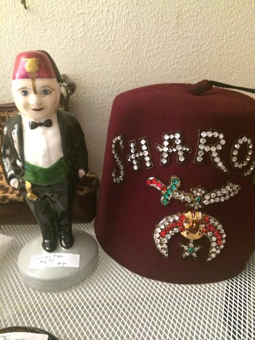             Shriner's fez & statue