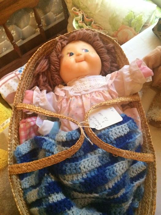           Cabbage Patch doll in basket
