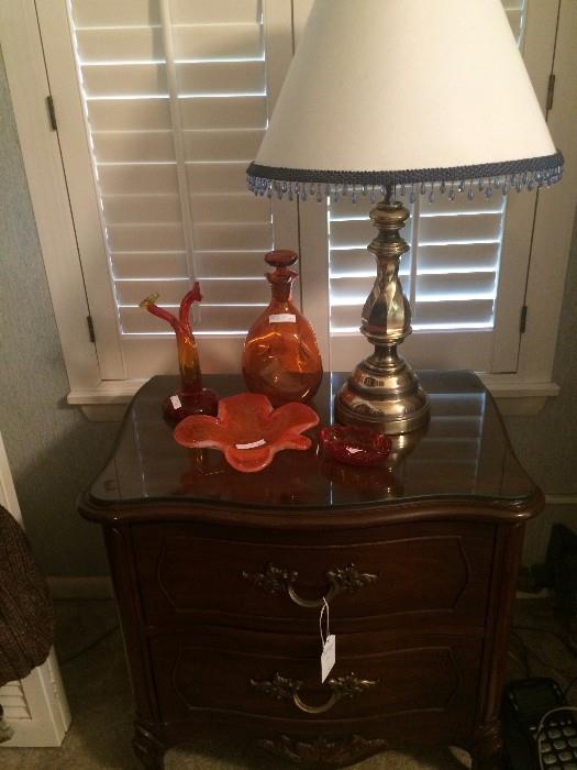Night stand; orange glass ware; one of several lamps
