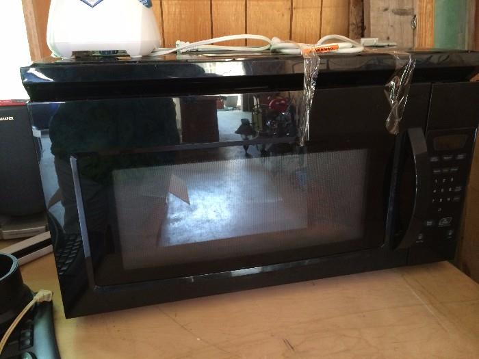 Black Amana Microwave for mounting above range