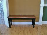 There are two of these lovely two toned wood benches.