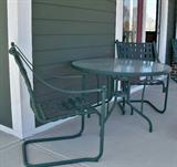 Patio set has four chairs