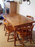 Oak kitchen table with pull out leaves.