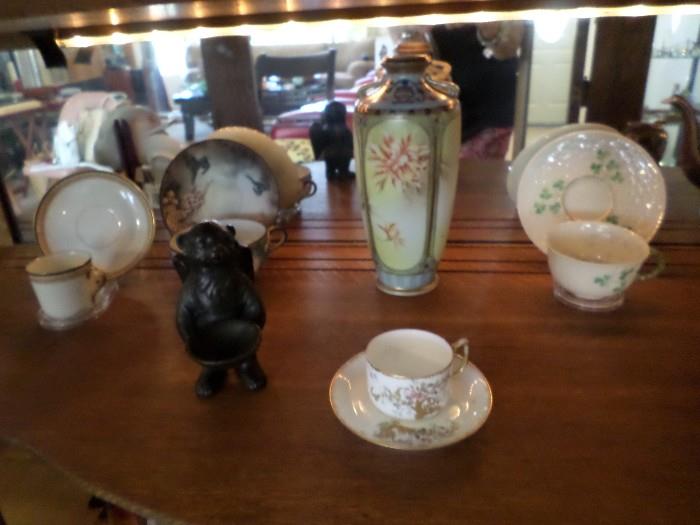 Collection of tea cups and demitasse cups 