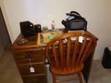small knee hole desk, JCS digital video camera, oak chair