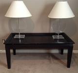 black coffee table and pair of lucite lamps