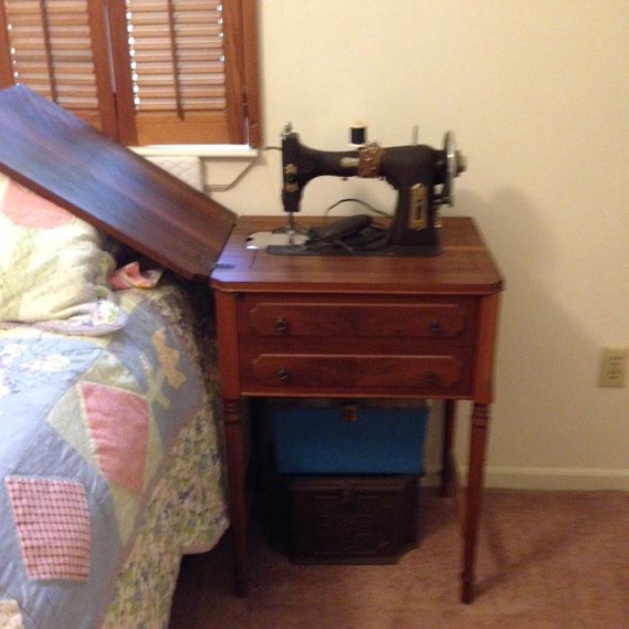 Sewing machine with cabinet