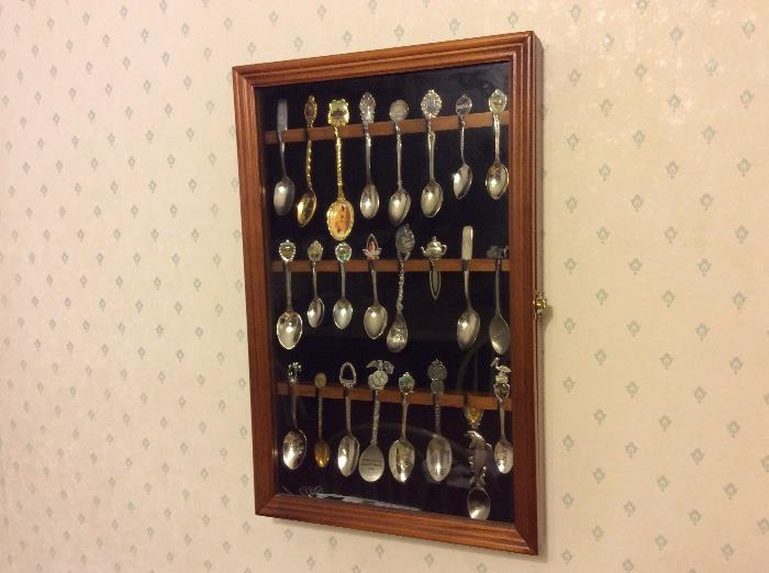 Several showcases of antique and collectible spoons